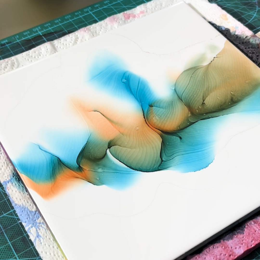 Close-up detail of translucent alcohol ink edge definitions and overlapping color gradients by VHacademy