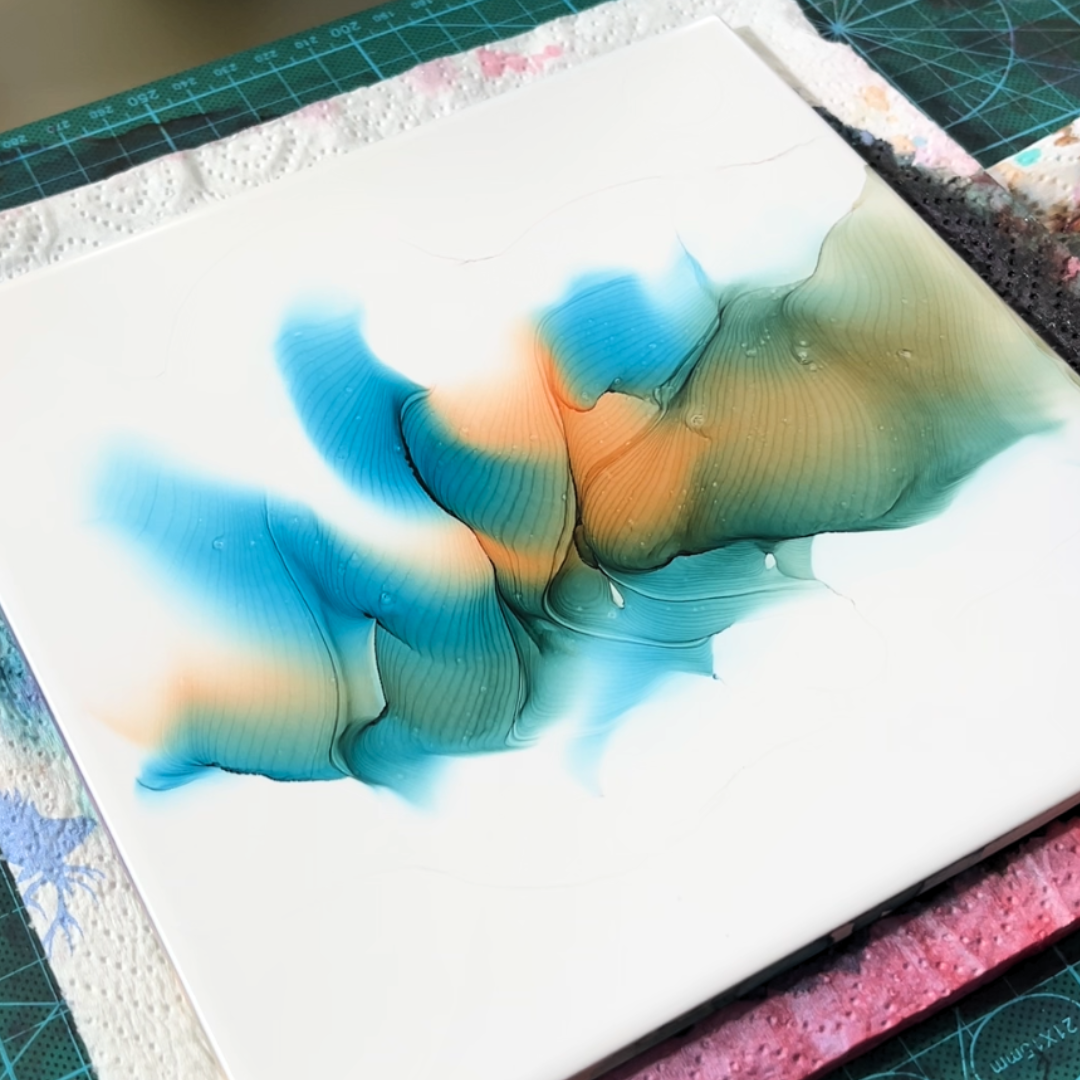 Organic fluid dynamics of turquoise and warm peach alcohol ink diffusion on white substrate by VHacademy