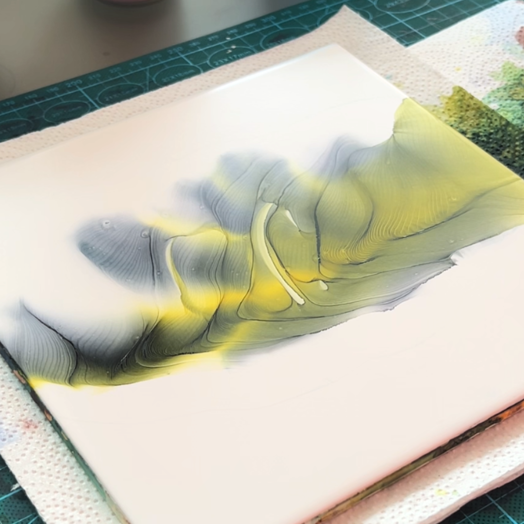 Layered fluid waves of charcoal grey and chartreuse lime yellow alcohol ink illustrating ink velocity by VHacademy