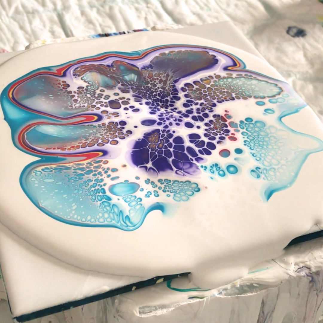 Fluid art experiment tile highlighting multi-colored purple and light cyan cell activation on a white base by VHacademy