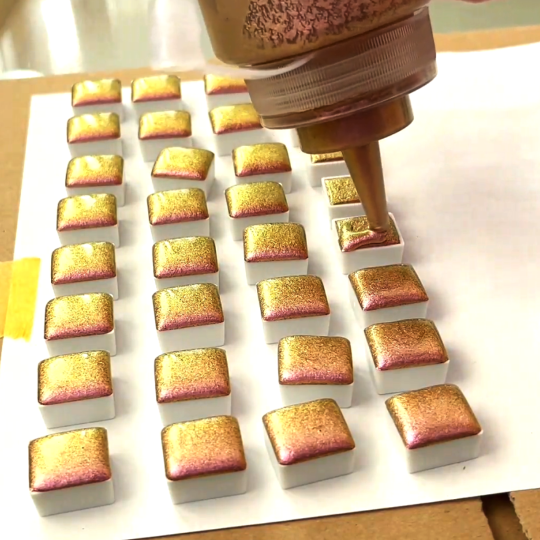 Filling half-pans with iridescent gold metallic watercolor paint using precision squeeze bottle by VHacademy