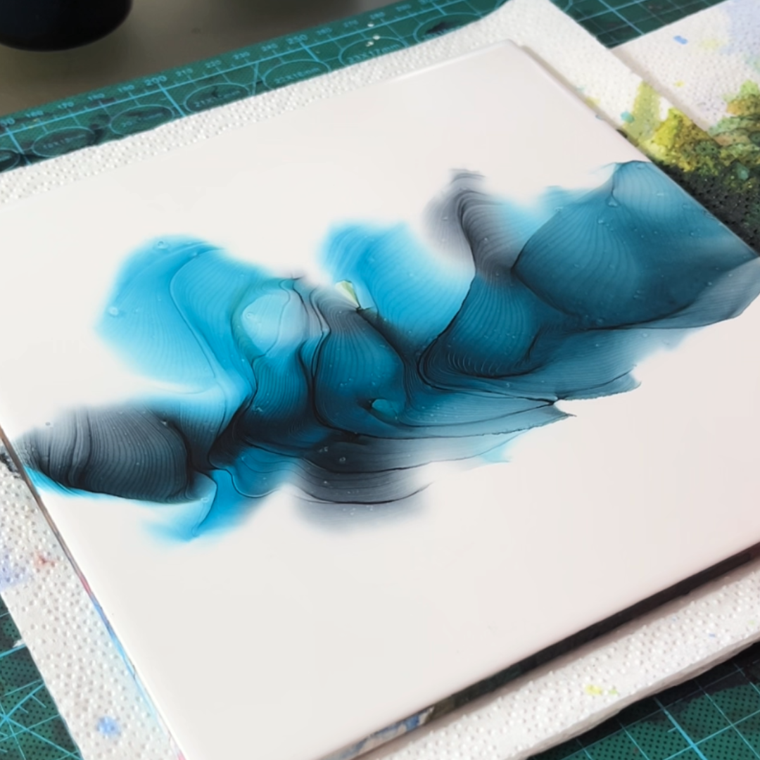 Broad sweeping motion of deep teal blue and emerald green alcohol ink displaying intricate ridge patterns by VHacademy