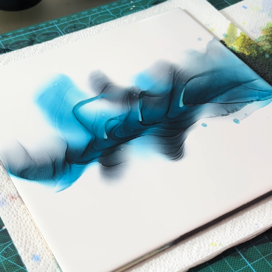 Broad sweeping motion of deep teal blue and emerald green alcohol ink displaying intricate ridge patterns by VHacademy